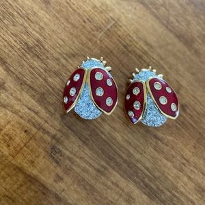 Two lady bug brooches